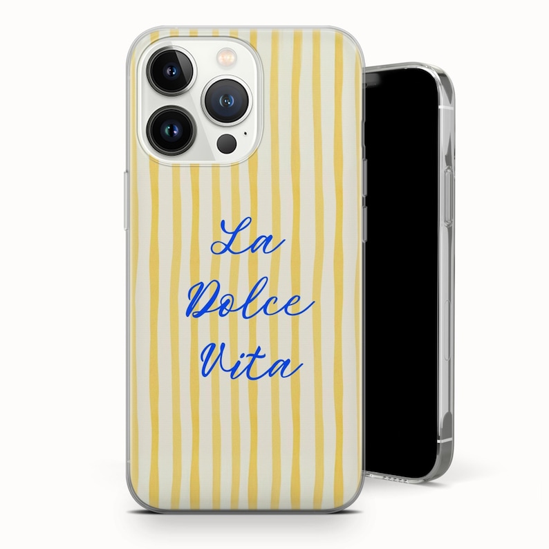May include: A clear phone case with a yellow and white striped pattern. The words "La Dolce Vita" are written in blue script. The phone case is on a white background.