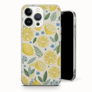May include: A clear phone case featuring a repeating pattern of yellow lemons, lemon slices, green leaves, and small blue flowers on a cream background. The phone case is shown with a black smartphone inside.