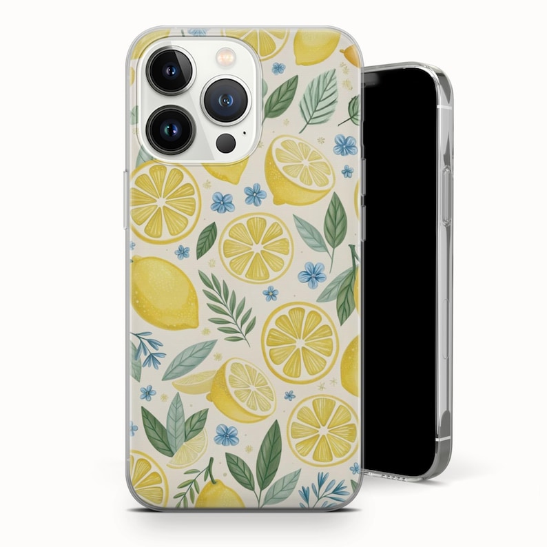 May include: A clear phone case featuring a repeating pattern of yellow lemons, lemon slices, green leaves, and small blue flowers on a cream background. The phone case is shown with a black smartphone inside.