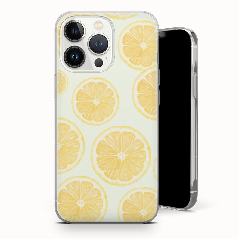 May include: A clear phone case featuring a pattern of yellow lemon slices on a light green background. The case is shown on a black smartphone, with the camera lenses visible.