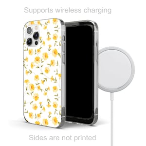 May include: A clear phone case with a white background and a yellow floral pattern. The case is compatible with wireless charging. The text "Supports wireless charging" is printed above the case. The text "Sides are not printed" is printed below the case.