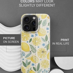 May include: A phone case with a lemon pattern. The case features a repeating design of yellow lemons, lemon slices, green leaves, and small blue flowers on a white background. The text on the image says "THIS IS DURABLE UV PRINT" and "COLORS MAY LOOK SLIGHTLY DIFFERENT."