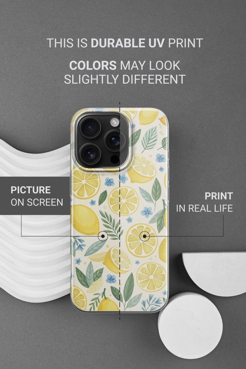 May include: A phone case with a lemon pattern. The case features a repeating design of yellow lemons, lemon slices, green leaves, and small blue flowers on a white background. The text on the image says "THIS IS DURABLE UV PRINT" and "COLORS MAY LOOK SLIGHTLY DIFFERENT."