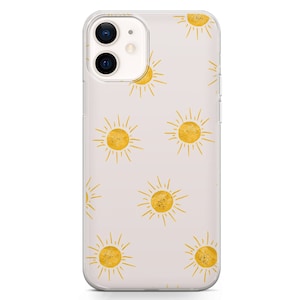 May include: A clear phone case with a pattern of yellow suns on a light pink background.
