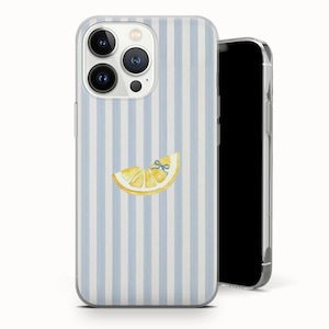 May include: A clear phone case with a light blue and white striped pattern. The case features a watercolor illustration of a lemon slice with a blue bow. The phone case is designed to fit a smartphone.