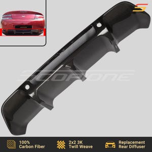 May include: A carbon fiber rear diffuser for a car. The diffuser has a 2x2 3K twill weave pattern and is made of 100% carbon fiber. It is a replacement rear diffuser.