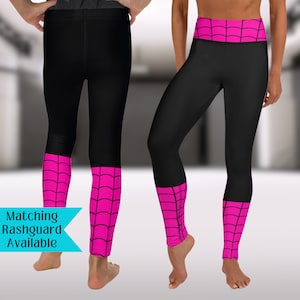 May include: Black leggings with pink spiderweb design on the waistband and lower legs. Matching rashguard available.