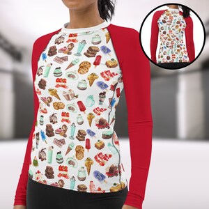 May include: A white long-sleeve shirt with red sleeves and a pattern of various desserts, including ice cream, cake, and cookies.