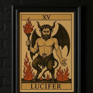 May include: Framed tarot card print featuring Lucifer. The illustration depicts a horned, winged figure holding a torch, surrounded by flames. The card is labeled "XV" at the top and "LUCIFER" at the bottom.