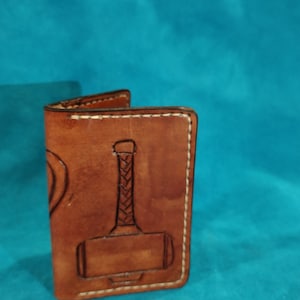 Cartera nudo serpiente y martillo