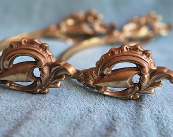 Paar vintage messing sierlijke gordijnbandjes