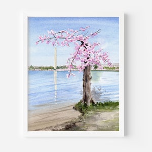 May include: A watercolor painting of a cherry blossom tree in full bloom, with the Washington Monument in the background. The tree is on the shore of a body of water, with a sandy beach in the foreground.