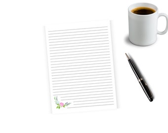 May include: A blank lined sheet of paper with a floral design in the bottom left corner. The paper is on a white surface with a black pen and a white mug of coffee.