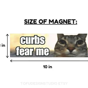 May include: A rectangular magnet featuring the text "curbs fear me" in white letters with a black outline next to a close-up image of a cat's face. The magnet measures 3 inches by 10 inches as indicated by the black arrows and dimension labels.