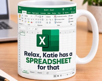 May include: A white ceramic mug featuring a printed Microsoft Excel interface design. The mug displays the green Excel logo and the text "Relax, Katie has a SPREADSHEET for that" in dark blue and green lettering over a grid of spreadsheet cells.