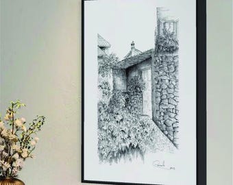May include: Black and white drawing of a stone building with a doorway and a window. The building is surrounded by greenery. The drawing is framed in a black frame. The text "ANNECY - FRANCE" is at the top of the frame.