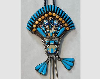 Zuni-style bolo tie with intricate multi-stone mosaic inlay including turquoise and coral, set in sterling silver. Southwestern Jewelry