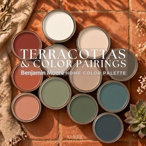 May include: A collection of twelve circular paint cans arranged in a cluster, each displaying a different color including white, beige, terracotta, sage green, and deep blue. The text TERRACOTTAS & COLOR PAIRINGS Benjamin Moore HOME COLOR PALETTE is centered.