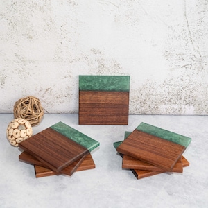 Stunning set of 7 coasters in Tasmanian blackwood edged with solid hunter green resin. Measures 100mms square