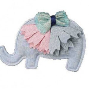 May include: A light blue stuffed elephant toy with a decorative bow. The bow is a mix of blue, pink, and gray fabric. The elephant has a trunk and is standing on four legs. The toy is made of soft fabric.