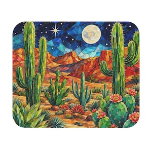 May include: A rectangular coaster featuring a stained glass style desert landscape at night. The scene depicts tall green cacti, blooming pink flowers, and agave plants under a dark blue sky with a bright full moon and a glowing star.