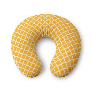 May include: A C-shaped nursing pillow featuring a vibrant mustard yellow background with a repeating white quatrefoil geometric pattern. The pillow has a soft, rounded contour designed for support, with a consistent fabric texture throughout.