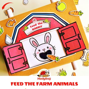 Puede incluir: Un juego de actividad de cartón con forma de granero que muestra un conejo blanco con la boca abierta. El granero tiene puertas rojas y un letrero que dice Feed the RABBIT. Alrededor hay recortes de comida como una zanahoria y una manzana.