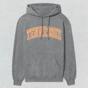 May include: A gray hooded sweatshirt with a large orange arch design that says "TENNESSEE".