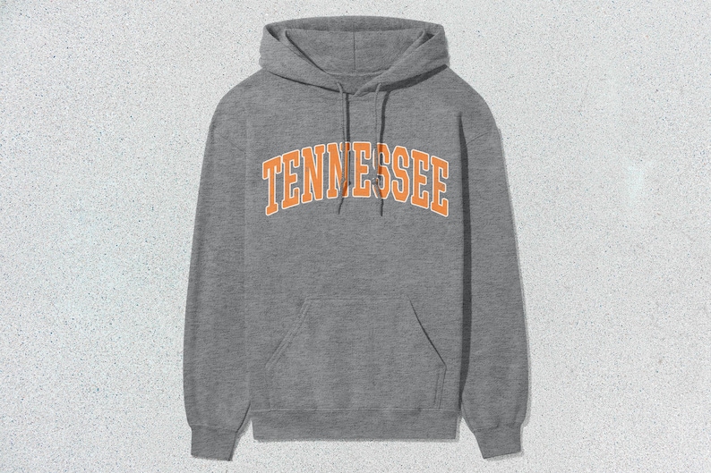 May include: A gray hooded sweatshirt with a large orange arch design that says "TENNESSEE".