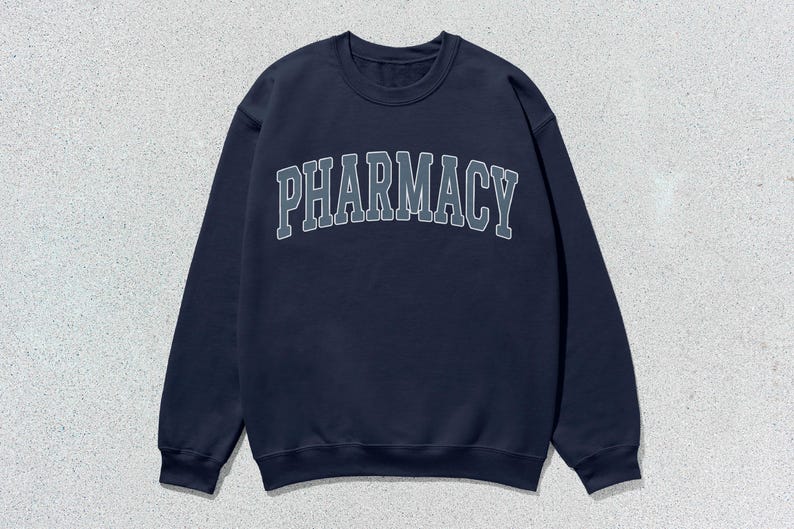 May include: A navy blue sweatshirt with the word "PHARMACY" printed in white on the front.