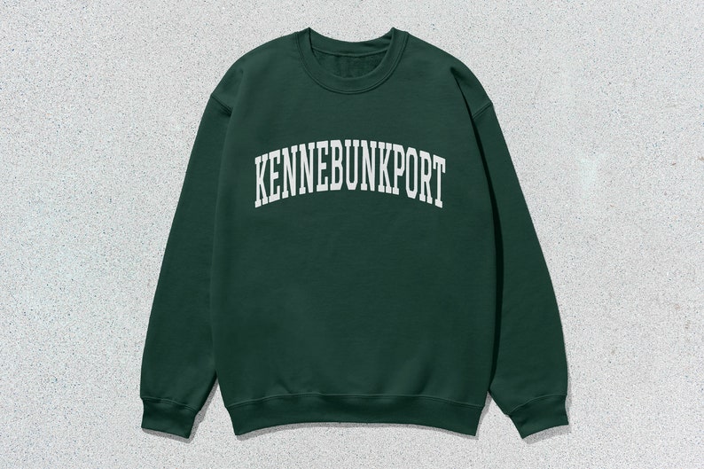 May include: A dark green sweatshirt with the text "KENNEBUNKPORT" in white.