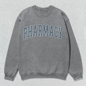 May include: A gray sweatshirt with the word "PHARMACY" printed in blue on the front.