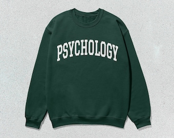 May include: A dark green sweatshirt with the word "PSYCHOLOGY" printed in white on the front.