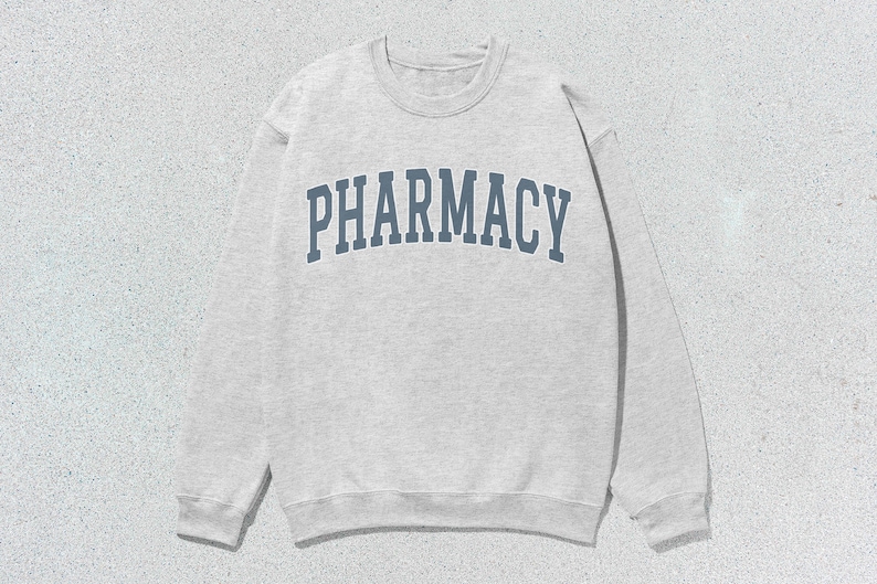 May include: A gray sweatshirt with the word "PHARMACY" printed in blue on the front.