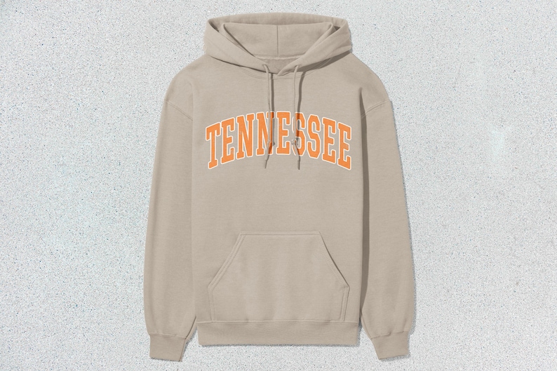 May include: A beige hoodie with an orange "TENNESSEE" graphic on the front.
