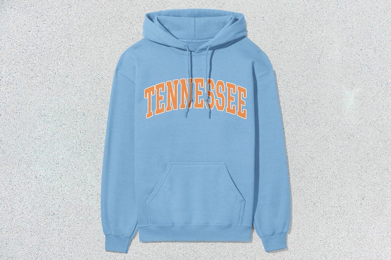 May include: A light blue hoodie with a large orange "TENNESSEE" graphic on the front.