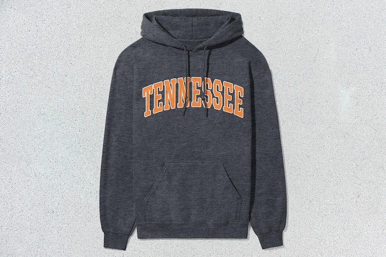 May include: A dark gray hooded sweatshirt with the word "TENNESSEE" printed in orange on the front.