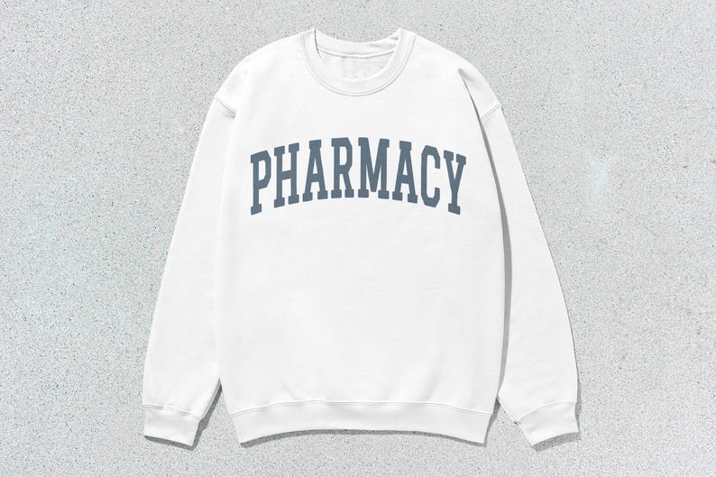 May include: White sweatshirt with a blue arch design that says "PHARMACY" on the front.