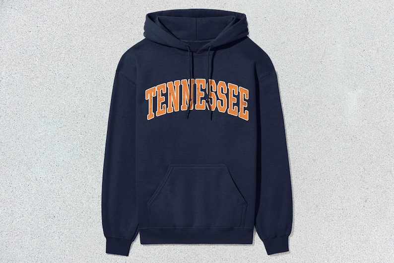 May include: A navy blue hooded sweatshirt with the word "TENNESSEE" printed in orange on the front.