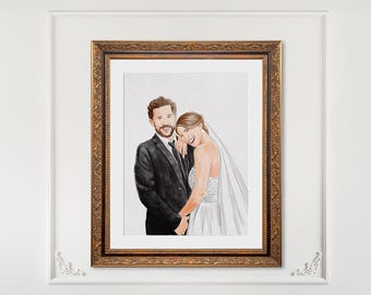 May include: A framed watercolor portrait of a couple. The man wears a black suit and tie, and the woman is in a white wedding dress with a veil. The frame is gold with ornate detailing. The artwork is displayed on a white wall.