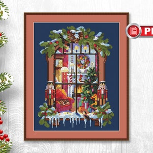 May include: A cross-stitch pattern featuring a cozy Christmas scene viewed through a window. The window is decorated with a wreath and icicles. Inside, a fireplace is lit, and a Christmas tree is decorated with ornaments. Two nutcracker figurines stand on either side of the window.
