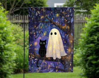 May include: A Halloween garden flag featuring a black cat and a ghost under a tree with a dark blue background. The ghost is white with two black eyes. The cat has green eyes. The tree has blue leaves and yellow lights.