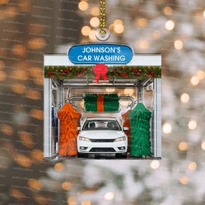 May include: A white car is being washed in a car wash. The car wash has a sign that says "Johnson's Car Washing". The car wash is decorated with red and green Christmas decorations.