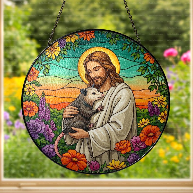 May include: A stained glass window hanging features a colorful depiction of Jesus holding a possum. The background is a vibrant floral design with a sunset.