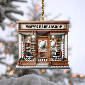 May include: A Christmas bauble shaped like a barbershop with a red, white and blue barber's pole, a sign that reads "Wavy's Barbershop", and two barber chairs.