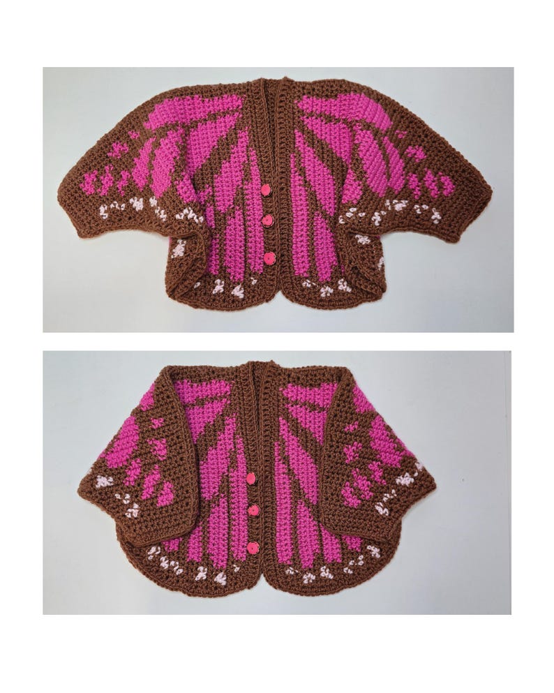 May include: A crochet cardigan featuring a butterfly wing pattern in brown, bright pink, and white. The garment has short sleeves, a rounded hem, and three small pink buttons down the center front. The design mimics the appearance of insect wings.