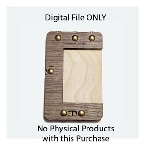 May include: A wooden box with a light wood interior and brass accents. The box has a label that says "Commander Damage" and a smaller label that says "Cast". The box has a number of small brass knobs on the front.