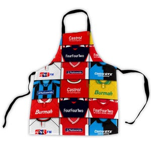 May include: A black apron with a patchwork design of football shirts. The shirts are in various colours and feature logos such as "Castrol," "FourFourTwo," and "Burmah." The apron has a black neck strap and waist ties.
