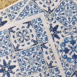 May include: Blue and white patterned tile stickers with a floral design. The stickers are arranged in a grid pattern.