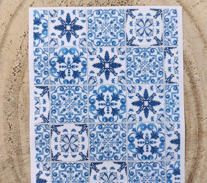 May include: A white and blue patterned tile design with a repeating geometric pattern. The tiles are arranged in a grid pattern.